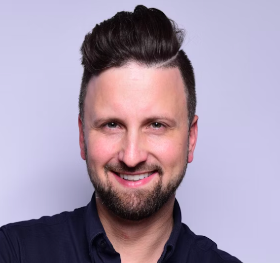 Bearded man in dark shirt